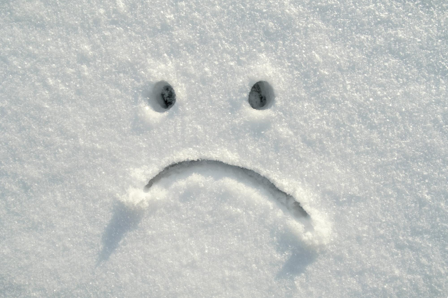 A sad face written in snow