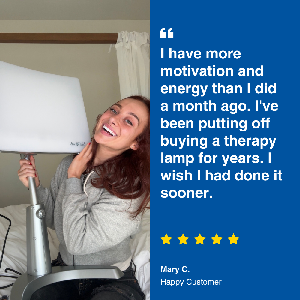 An image of a woman holding a therapy lamp with review text